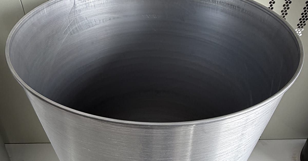 Large Capacity Metal Spinning for Chemical and Food Containers.